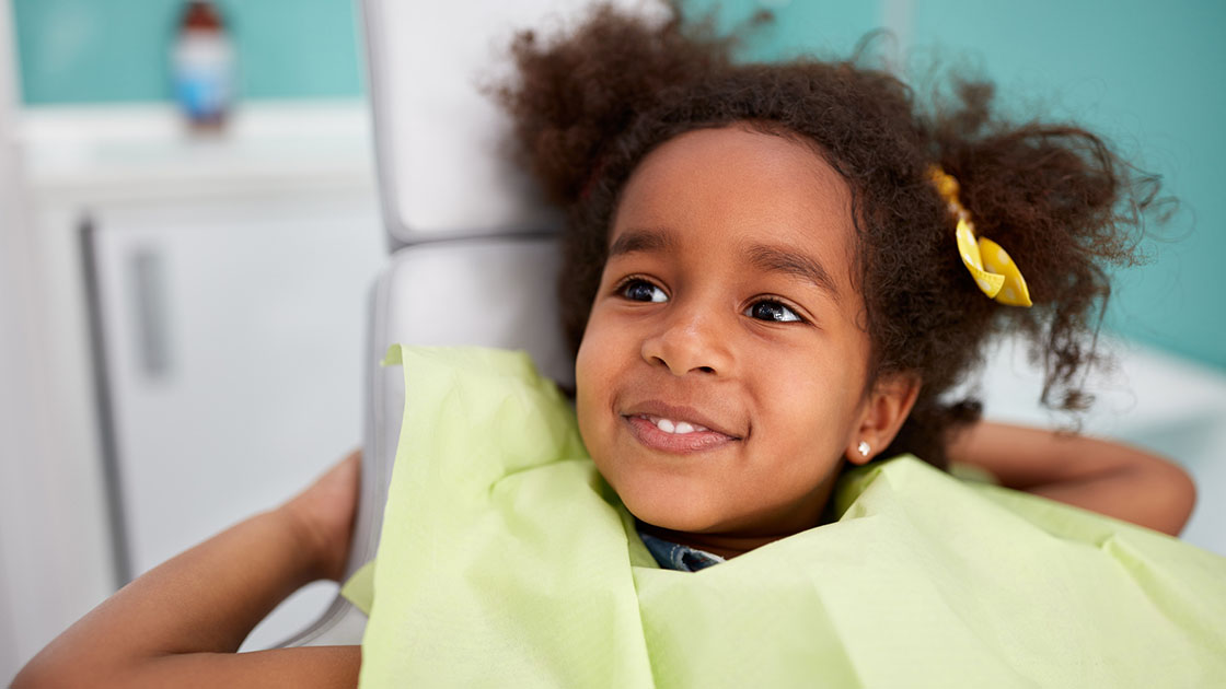 young girl in dentist chair